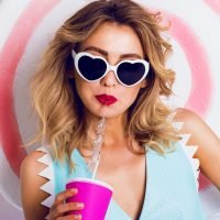 pretty-girl-in-sunglasses-with-beautiful-skin-and-lips-posing-in-studio.jpg